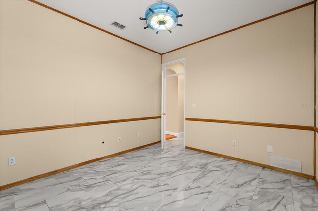 3637 Rothbury Dr, Belle Isle, FL 32812 - spare room featuring baseboards, visible vents, ornamental molding, and marble finish floor