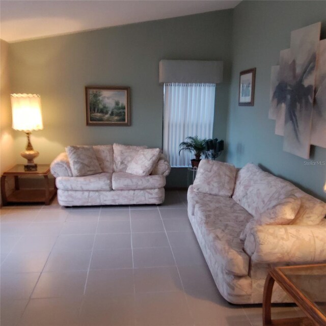 12966 Broakfield Cir, Orlando, FL 32837 - living room featuring tile patterned floors and lofted ceiling