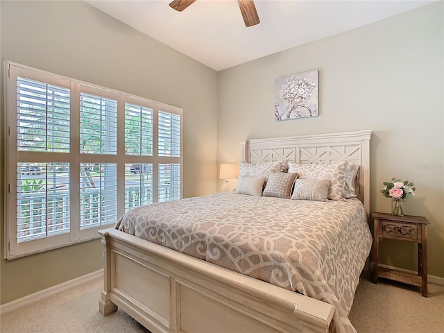 501 Heartwell Dr, Poinciana, FL 34759 - bedroom featuring light carpet, baseboards, and ceiling fan