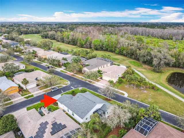 501 Heartwell Dr, Poinciana, FL 34759 - bird's eye view featuring a residential view, golf course view, and a wooded view