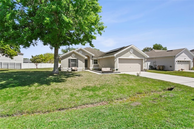 323 Azincourt Ln, Kissimmee, FL 34759 - single story home with fence, driveway, a front yard, solar panels, and a garage