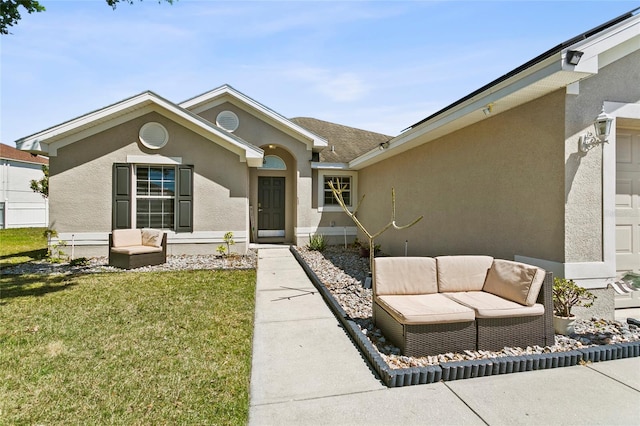 323 Azincourt Ln, Kissimmee, FL 34759 - ranch-style house with an outdoor hangout area, stucco siding, and a front lawn