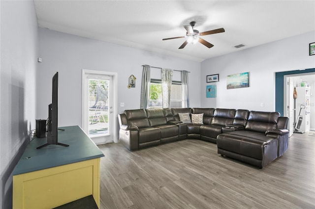 323 Azincourt Ln, Kissimmee, FL 34759 - living area with a ceiling fan, wood finished floors, and visible vents