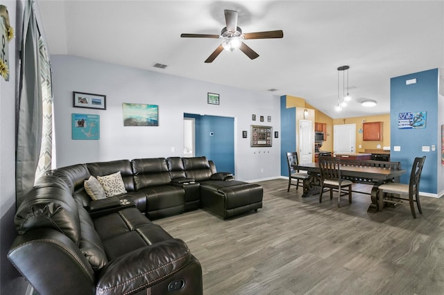 323 Azincourt Ln, Kissimmee, FL 34759 - living room featuring wood finished floors, lofted ceiling, ceiling fan, and visible vents