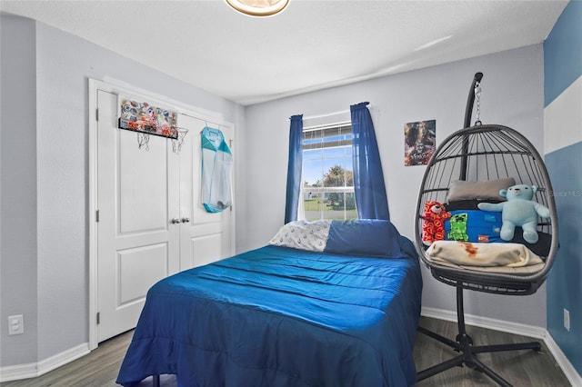 323 Azincourt Ln, Kissimmee, FL 34759 - bedroom with baseboards and wood finished floors