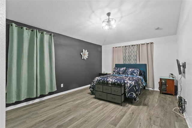 323 Azincourt Ln, Kissimmee, FL 34759 - bedroom with baseboards and wood finished floors