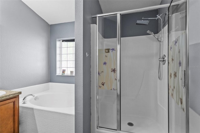 323 Azincourt Ln, Kissimmee, FL 34759 - full bath featuring a bath, vanity, a textured wall, and a shower stall