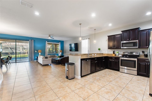 kitchen with open floor plan, light tile patterned floors, appliances with stainless steel finishes, and visible vents