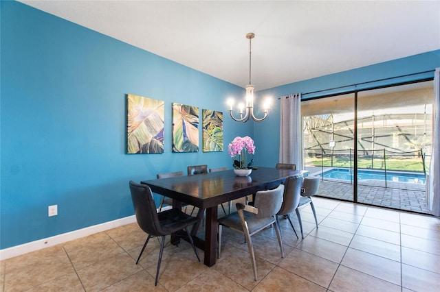 unfurnished dining area featuring baseboards, a chandelier, and light tile patterned floors