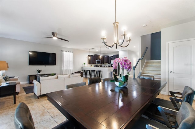dining area with stairway, ceiling fan with notable chandelier, light tile patterned floors, baseboards, and recessed lighting