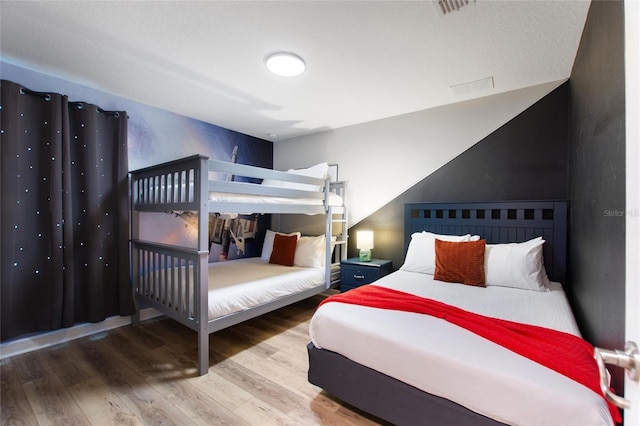 bedroom featuring wood finished floors