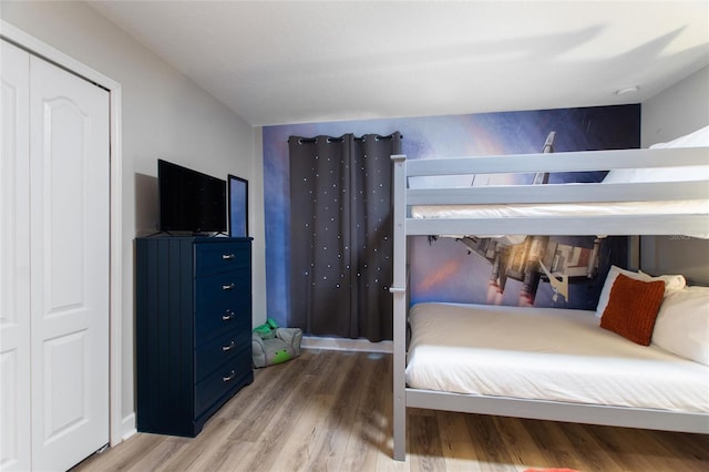 bedroom with light wood finished floors