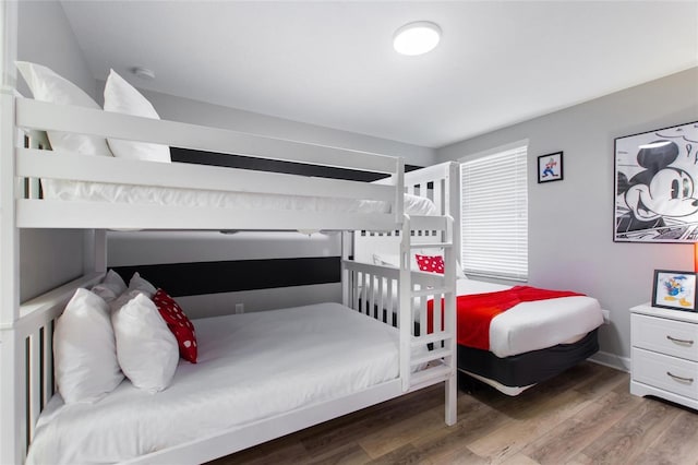 bedroom featuring wood finished floors