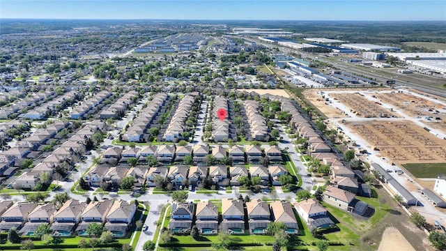 birds eye view of property with a residential view