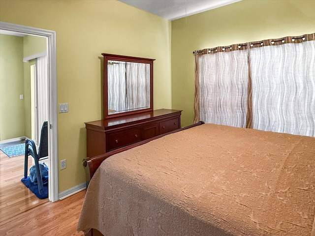 7733 Beridale Ct, Orlando, FL 32818 - bedroom with baseboards and wood finished floors