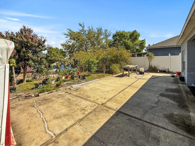 7733 Beridale Ct, Orlando, FL 32818 - view of patio featuring a fenced backyard
