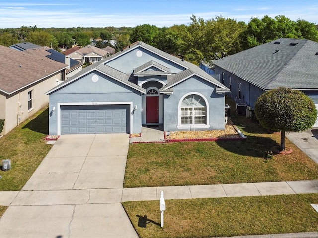 7733 Beridale Ct, Orlando, FL 32818 - ranch-style house with stucco siding, an attached garage, driveway, central AC unit, and a front yard