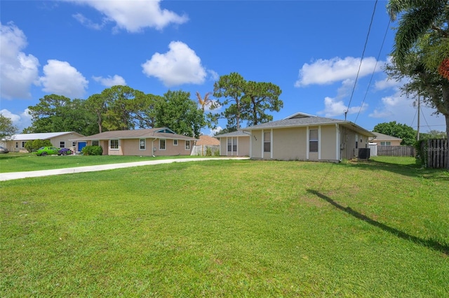 554 NW Twylite Ter, Port St Lucie, FL 34983 - view of front facade featuring central air condition unit and stucco siding