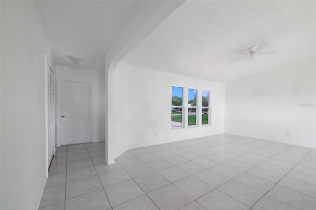 554 NW Twylite Ter, Port St Lucie, FL 34983 - spare room featuring light tile patterned flooring and ceiling fan