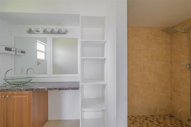 554 NW Twylite Ter, Port St Lucie, FL 34983 - full bathroom featuring a tile shower, vanity, and tile patterned floors