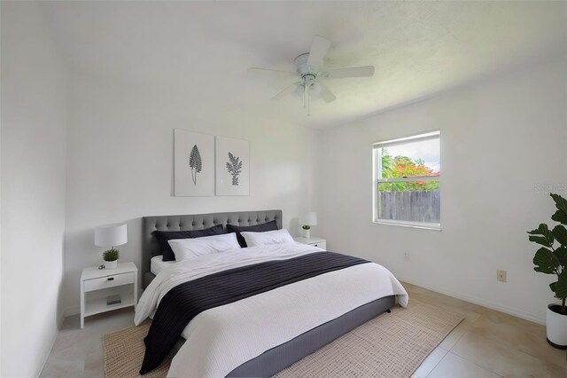 554 NW Twylite Ter, Port St Lucie, FL 34983 - bedroom featuring a ceiling fan, baseboards, and light tile patterned flooring