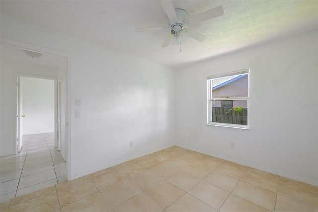 554 NW Twylite Ter, Port St Lucie, FL 34983 - unfurnished room featuring a ceiling fan, tile patterned floors, and baseboards