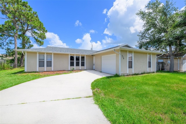 554 NW Twylite Ter, Port St Lucie, FL 34983 - ranch-style house with stucco siding, driveway, an attached garage, and a front lawn