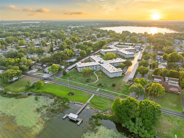 aerial view at dusk with a water view