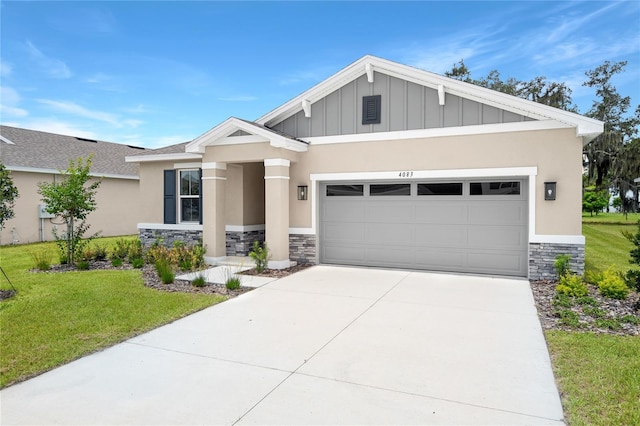 4083 Bannock Ave, Tavares, FL 32778 - craftsman-style home featuring stone siding, an attached garage, a front yard, concrete driveway, and board and batten siding