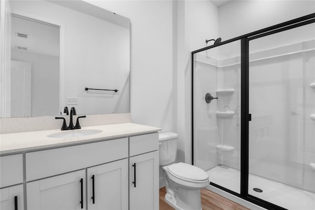 4083 Bannock Ave, Tavares, FL 32778 - full bath featuring a shower stall, vanity, and wood finished floors