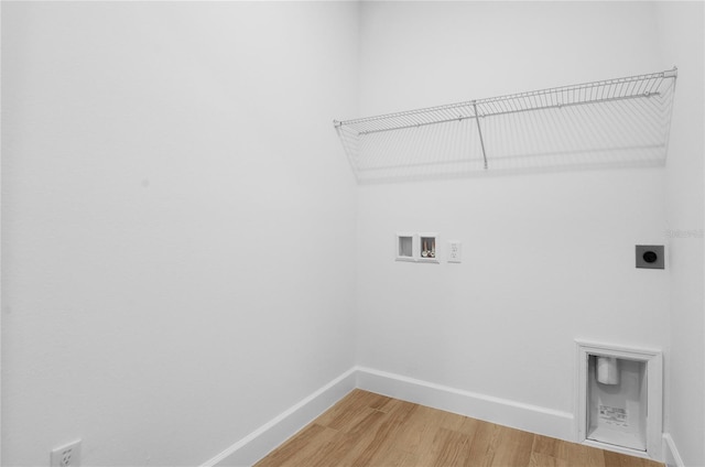 4083 Bannock Ave, Tavares, FL 32778 - laundry area featuring electric dryer hookup, washer hookup, and light wood-style flooring