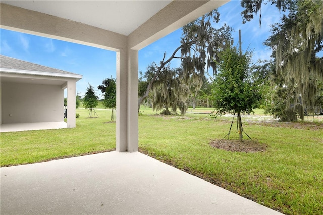 4083 Bannock Ave, Tavares, FL 32778 - view of grassy yard featuring a patio area