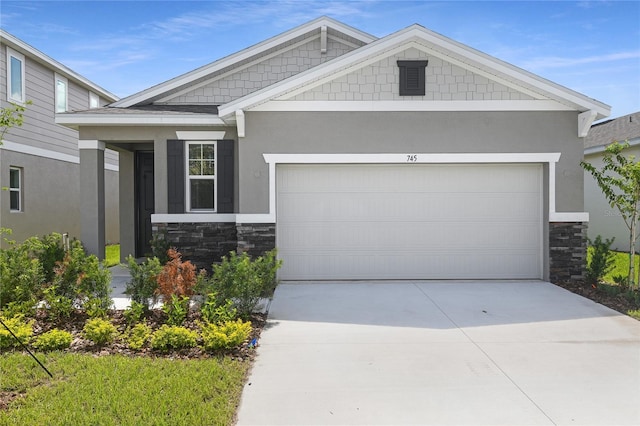 4079 Bannock Ave, Tavares, FL 32778 - craftsman-style house featuring stone siding, driveway, stucco siding, and a garage