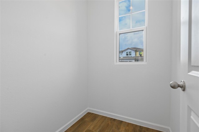 4079 Bannock Ave, Tavares, FL 32778 - empty room featuring dark wood-style floors and baseboards