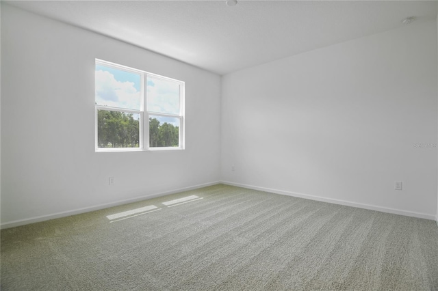 4079 Bannock Ave, Tavares, FL 32778 - spare room featuring a smoke detector and carpet floors