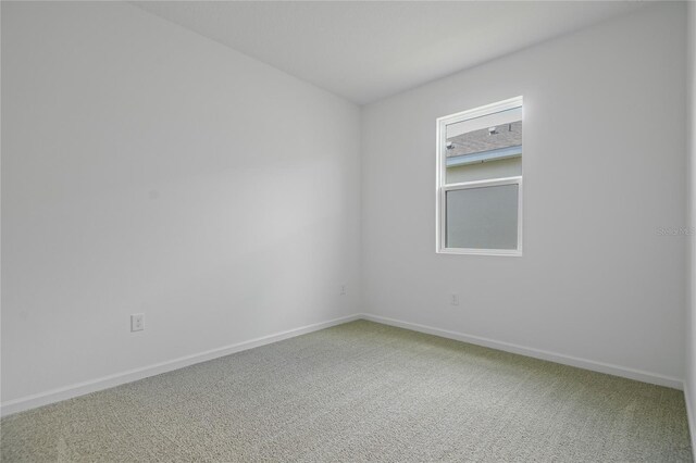 4079 Bannock Ave, Tavares, FL 32778 - carpeted empty room with baseboards