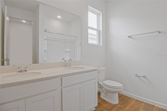 4079 Bannock Ave, Tavares, FL 32778 - bathroom featuring wood finished floors, double vanity, and a shower