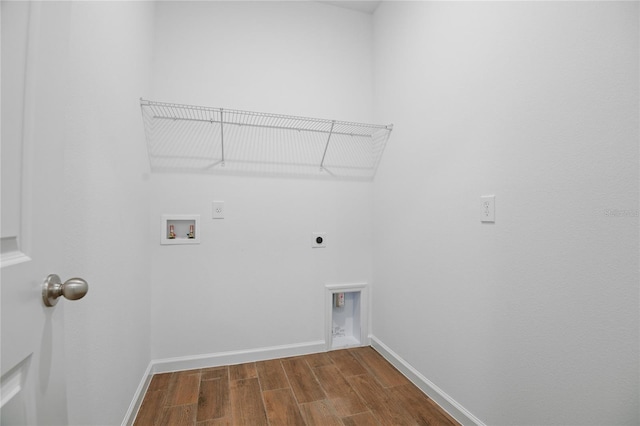 4079 Bannock Ave, Tavares, FL 32778 - laundry room with electric dryer hookup, washer hookup, and dark wood-style floors