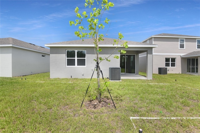 4079 Bannock Ave, Tavares, FL 32778 - rear view of property with a yard, a patio area, and stucco siding