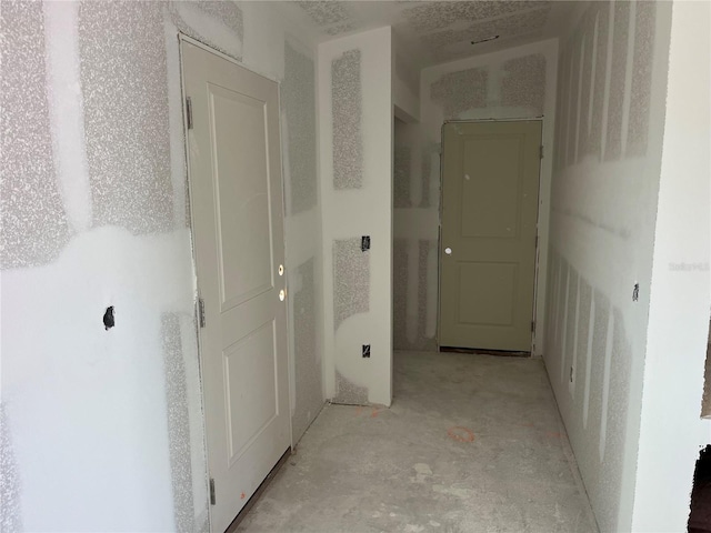 corridor featuring concrete flooring