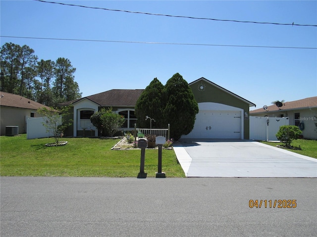 1155 Roan Ct, Kissimmee, FL 34759 - ranch-style home featuring central AC unit, a garage, fence, concrete driveway, and a front lawn