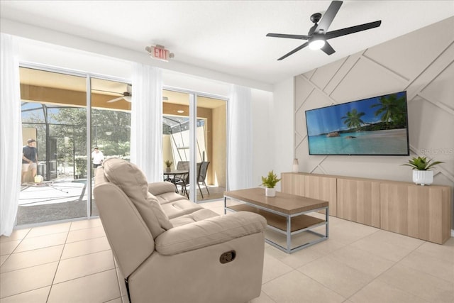 living area featuring light tile patterned floors and a ceiling fan