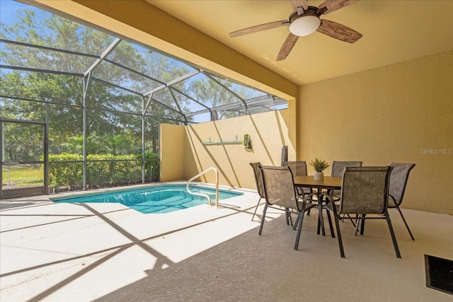outdoor pool featuring ceiling fan, outdoor dining area, a lanai, and a patio area