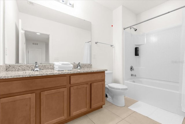 bathroom with toilet, tile patterned floors, a sink, visible vents, and double vanity