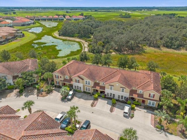 aerial view with a residential view and a water view