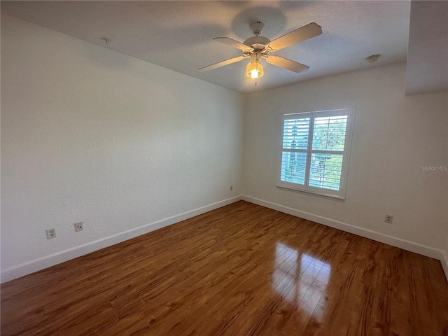 304 E S St Unit 5020, Orlando, FL 32801 - unfurnished room with baseboards, ceiling fan, and wood finished floors