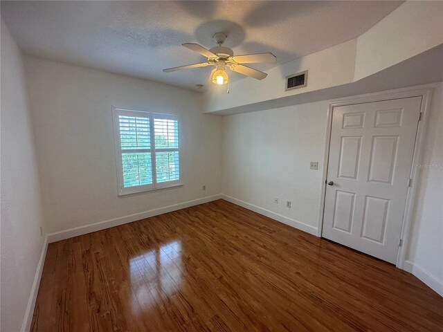 304 E S St Unit 5020, Orlando, FL 32801 - unfurnished room with baseboards, visible vents, and wood finished floors
