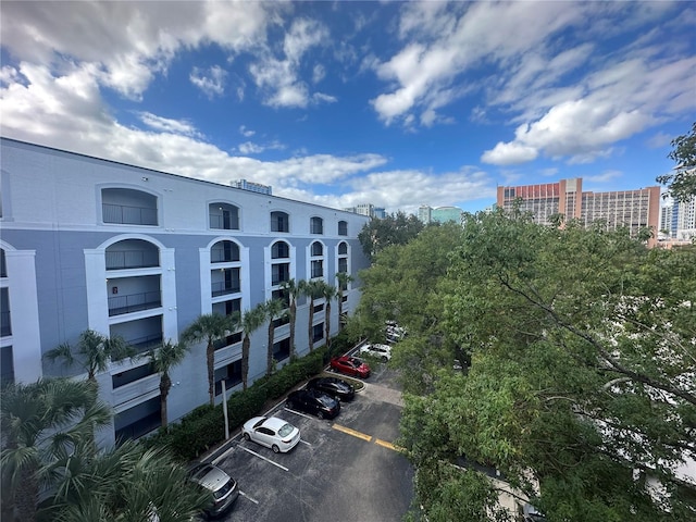 304 E S St Unit 5020, Orlando, FL 32801 - view of building exterior with a city view and uncovered parking
