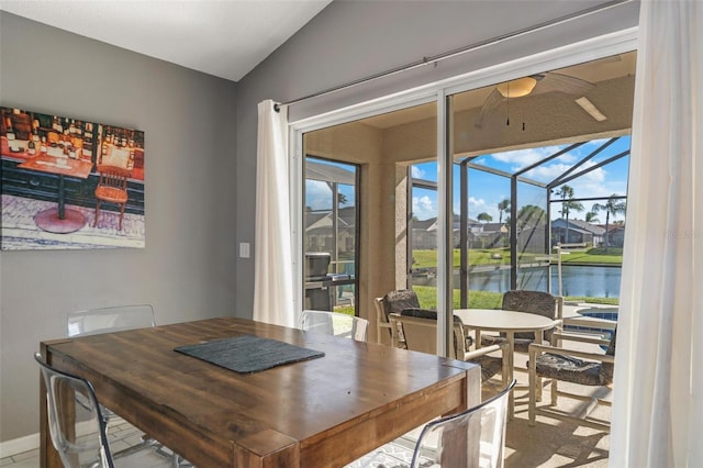 1048 Lake Berkley Dr, Kissimmee, FL 34746 - dining room featuring a water view, a sunroom, and ceiling fan