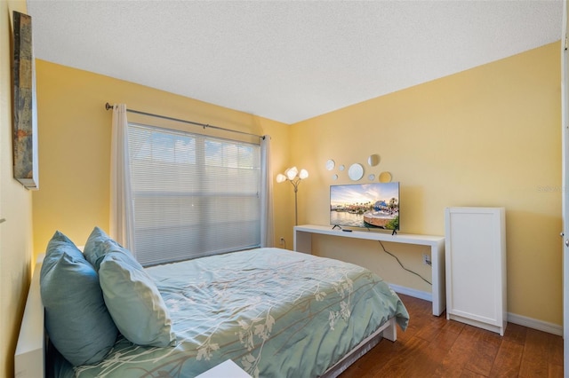 1048 Lake Berkley Dr, Kissimmee, FL 34746 - bedroom with baseboards and wood finished floors